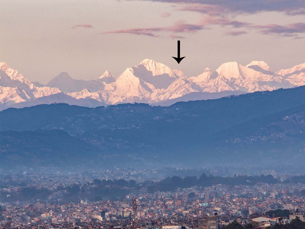 Mt Everest (arrow) hidden behind Mt Kang Nachugo and Mt Chobutse from Chobar in Kathmandu on 10 May. Credits ABHUSHAN GAUTAM